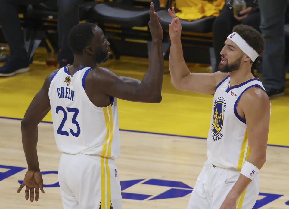 San Francisco - June 5: Golden State Warriors forward Draymond Green (23) celebrates teammate guard Klay Thompson (11) three point basket against the Boston Celtics during third quarter action. The Boston Celtics visit the Golden State Warriors for Game 2 of the NBA Finals at the Chase Center in San Francisco, CA on June 5, 2022. (Photo by Matthew J. Lee/The Boston Globe via Getty Images)