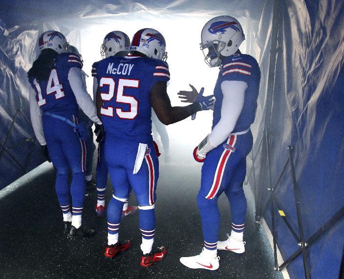 Buffalo Bills quarterback Tyrod Taylor, right, shakes hands with running back LeSean McCoy (25) prior to an NFL football game against the Cleveland Browns, Sunday, Dec. 18, 2016, in Orchard Park, N.Y. (AP Photo/Bill Wippert)