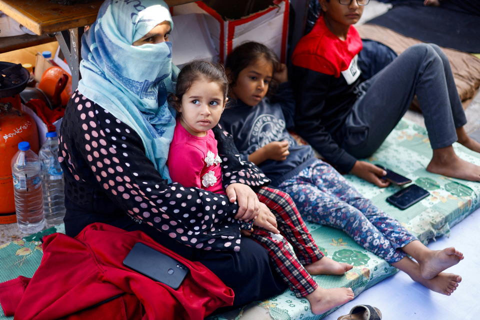 Palestinians, who fled their houses amid Israeli strikes, take shelter in a United Nations-run school, after Israel's call for more than 1 million civilians in northern Gaza to move south, in Khan Younis in the southern Gaza Strip, October 20, 2023. REUTERS/Mohammed Salem