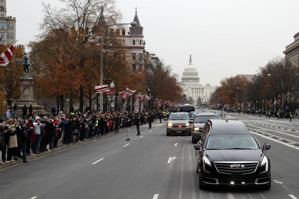 <p>The hearse carrying the flag-draped casket heads to the National Cathedral.</p>