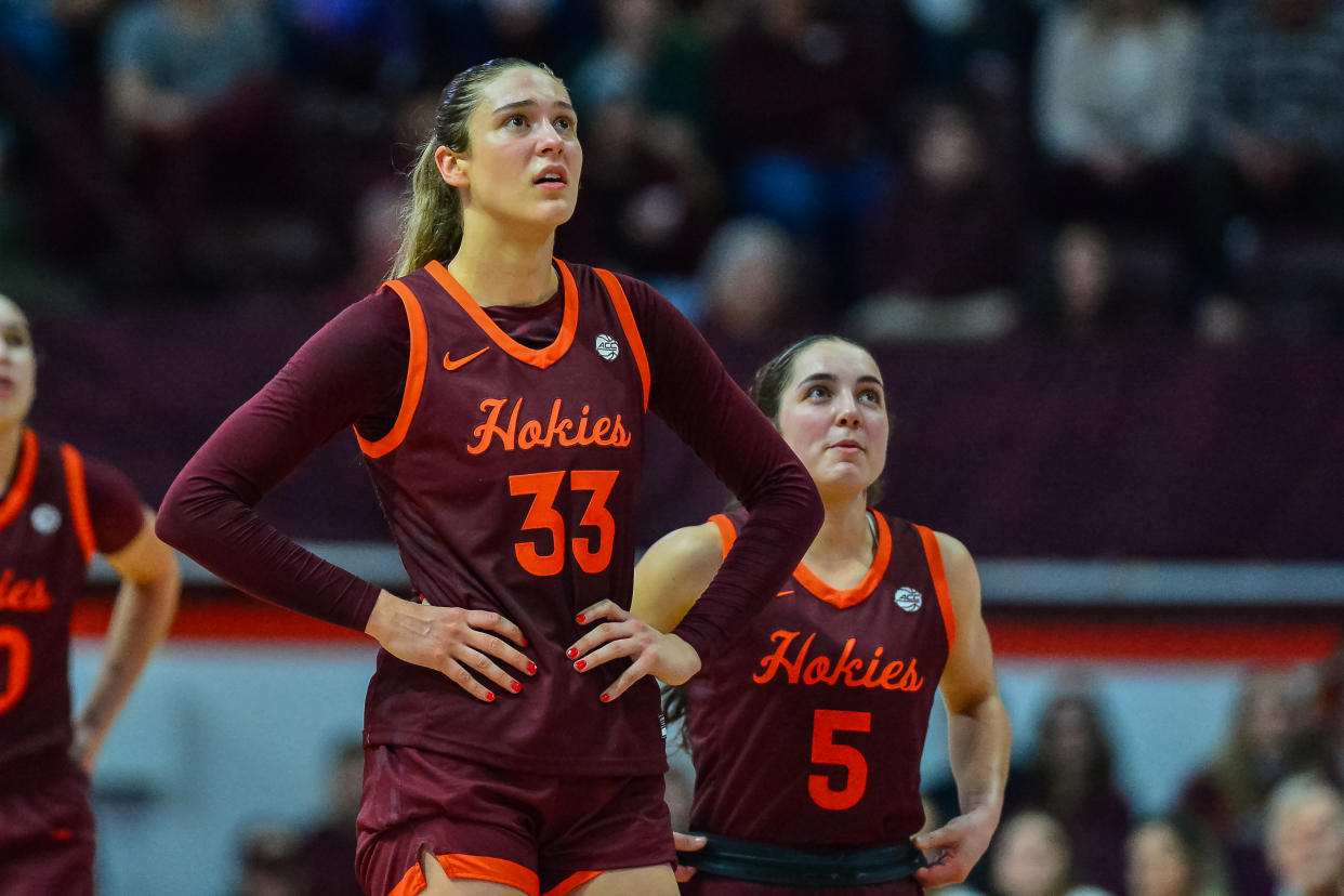 BLACKSBURG, VA - FEBRUARY 01:  Virginia Tech Hokies center Elizabeth Kitley (33) and Virginia Tech Hokies guard Georgia Amoore (5) watch the replay during a college basketball game between the Virginia Cavaliers and the Virginia Tech Hokies on February 1, 2024 at Cassell Coliseum in Blacksburg, VA. (Photo by Brian Bishop/Icon Sportswire via Getty Images)