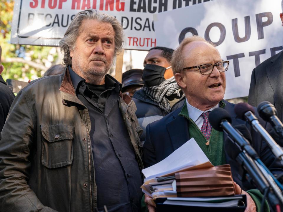 Former White House strategist Steve Bannon, center, and attorney David Schoen, right, pause to speak with reporters after departing federal court, Monday, Nov. 15, 2021, in Washington