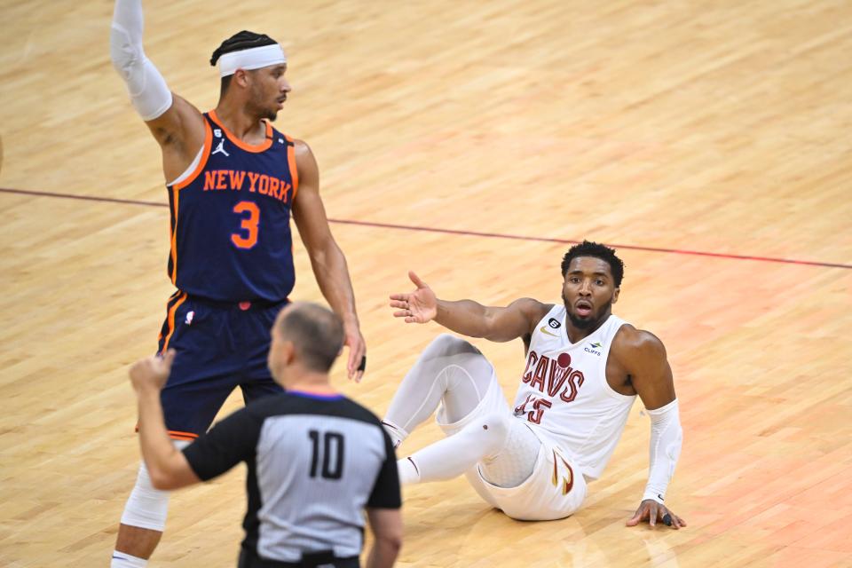 Apr 26, 2023;  Cleveland, Ohio, USA;  Cleveland Cavaliers guard Donovan Mitchell (45) reacts beside New York Knicks guard Josh Hart (3) after missing a basket in the second quarter during game five of the 2023 NBA playoffs at Rocket Mortgage FieldHouse.  Mandatory Credit: David Richard-USA TODAY Sports