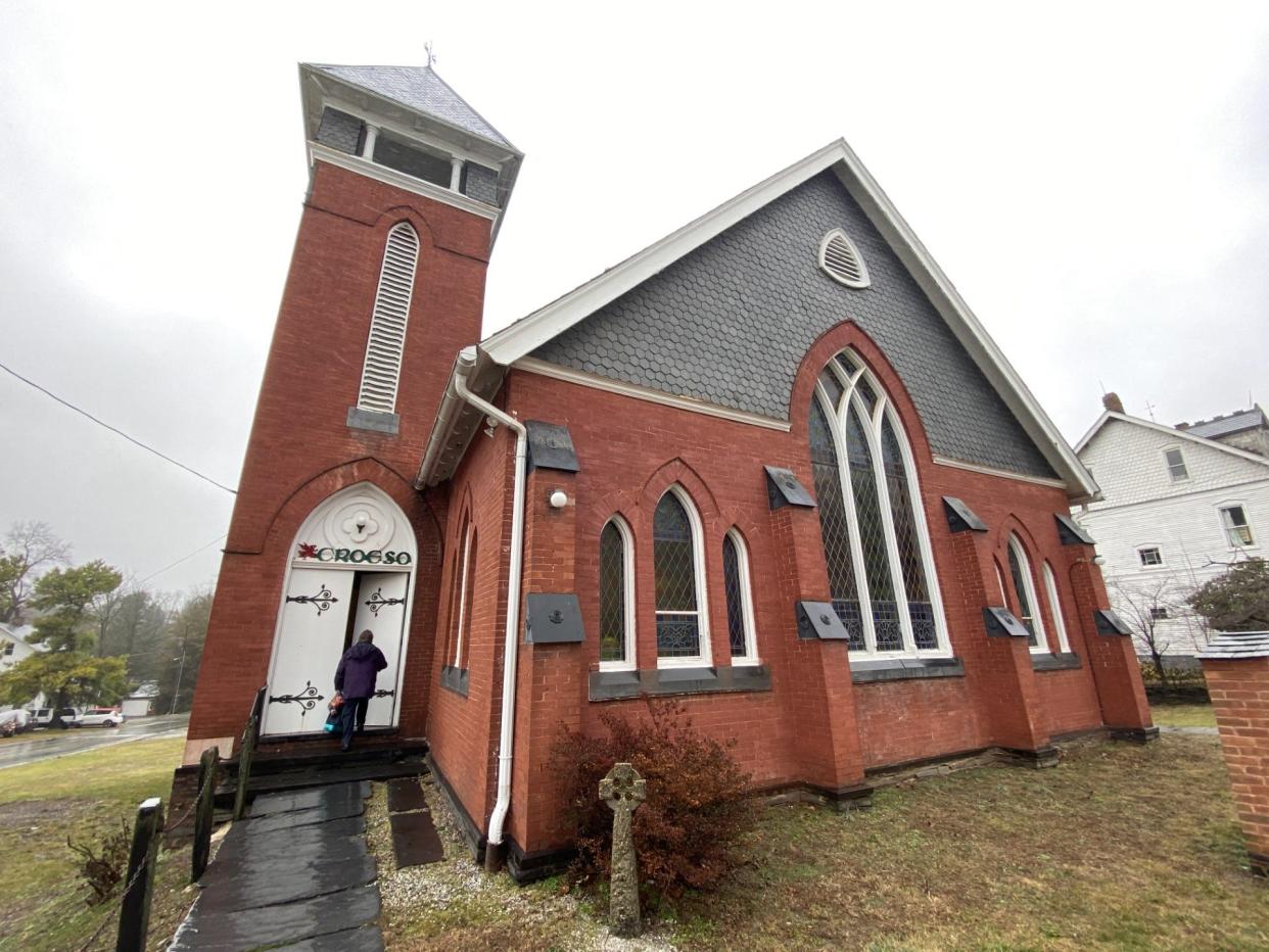 A congregant enters Rehoboth Welsh Chapel for a 2:30 p.m. service in late January. Among several other slate features, the chapel’s upper façade has slate siding.