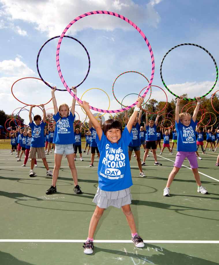The Largest Hula Hoop workout consisted of 221 students from Longleaf Elementary School in New Port Richey, Florida as part of Guinness World Records Day 2011. Photo: GWR