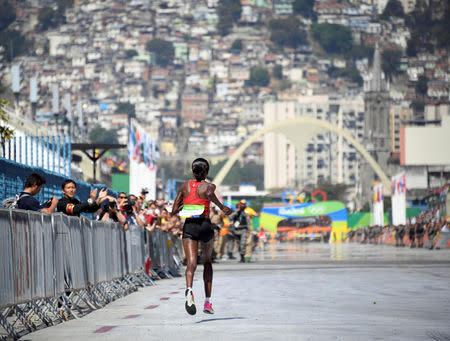 FILE PHOTO: 2016 Rio Olympics - Athletics - Final - Women's Marathon -Rio de Janeiro, Brazil - 14/08/2016. Jemima Sumgong of Kenya competes REUTERS/Johannes Eisele/Pool