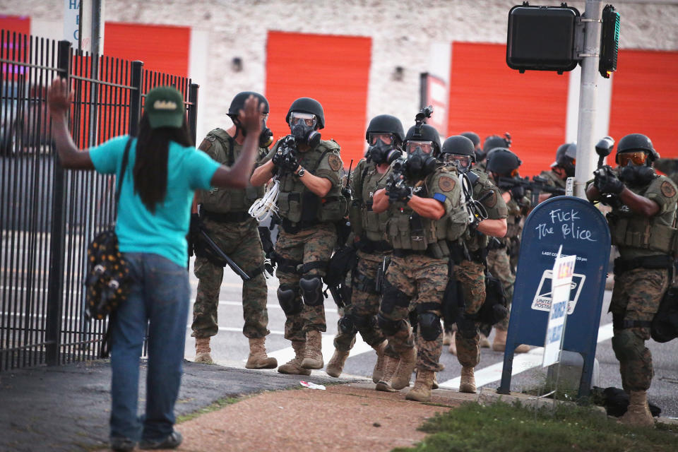 Police push&nbsp;protesters out of&nbsp;the business district on Aug. 11, 2014.&nbsp;