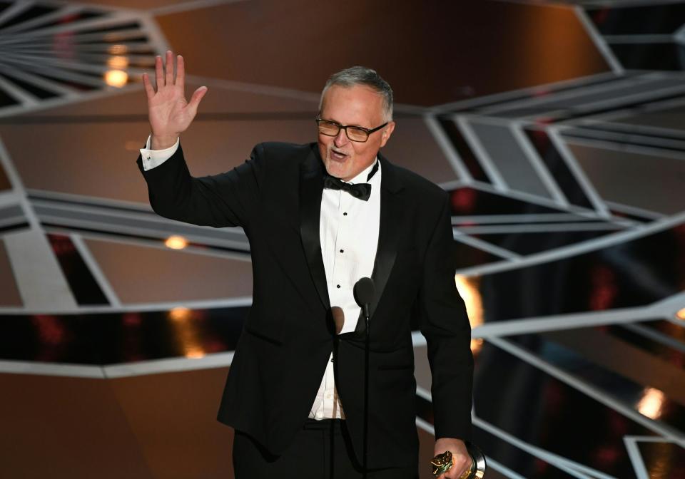 Australian Film Editor Lee Smith delivers a speech after he won the Oscar for Best Film Editing for
