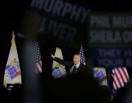 Senator Cory Booker waves at the election night victory rally for Phil Murphy, Governor-elect of New Jersey, in Asbury Park, New Jersey, U.S., November 7, 2017. REUTERS/Lucas Jackson