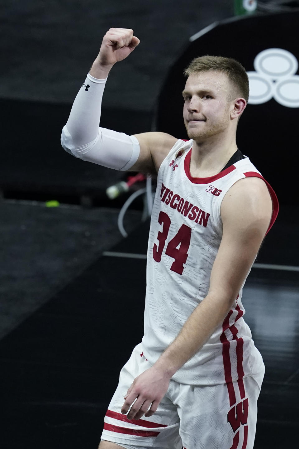 Wisconsin's Brad Davison celebrates as he leaves the court following an NCAA college basketball game against Penn State at the Big Ten Conference tournament, Thursday, March 11, 2021, in Indianapolis. Wisconsin won 75-74. (AP Photo/Darron Cummings)