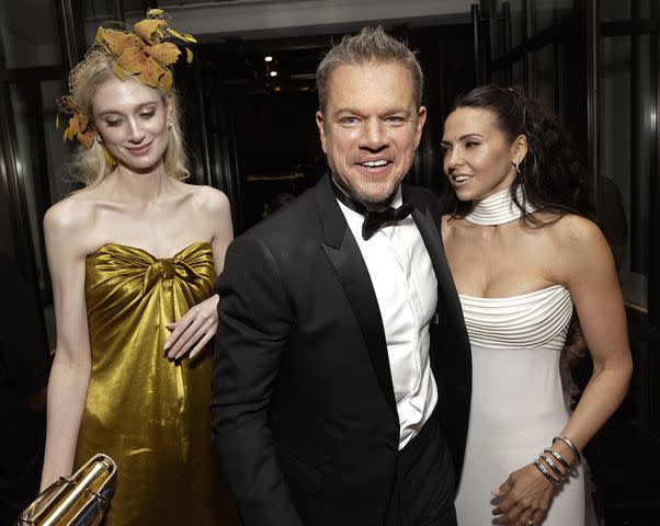 <p>Todd Williamson/JanuaryImages</p> Elizabeth Debicki (left), Matt Damon and Luciana Barroso at The Mark Hotel after the 2024 Met Gala