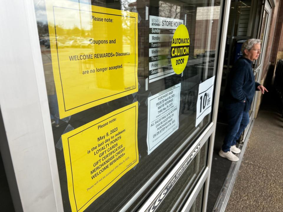 Notices to shoppers posted on the front door of a Bed Bath & Beyond store