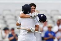 Britain Cricket - England v Pakistan - Second Test - Emirates Old Trafford - 22/7/16 England's Alastair Cook celebrates his century with Joe Root Action Images via Reuters / Jason Cairnduff Livepic