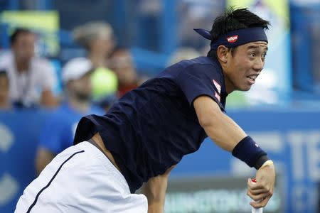 Aug 5, 2017; Washington, DC, USA; Kei Nishikori of Japan serves against Alexander Zverev of Germany (not pictured) in a men's singles semifinal at Fitzgerald Tennis Center. Mandatory Credit: Geoff Burke-USA TODAY Sports