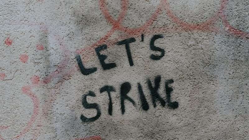 graffiti that says "let's strike"