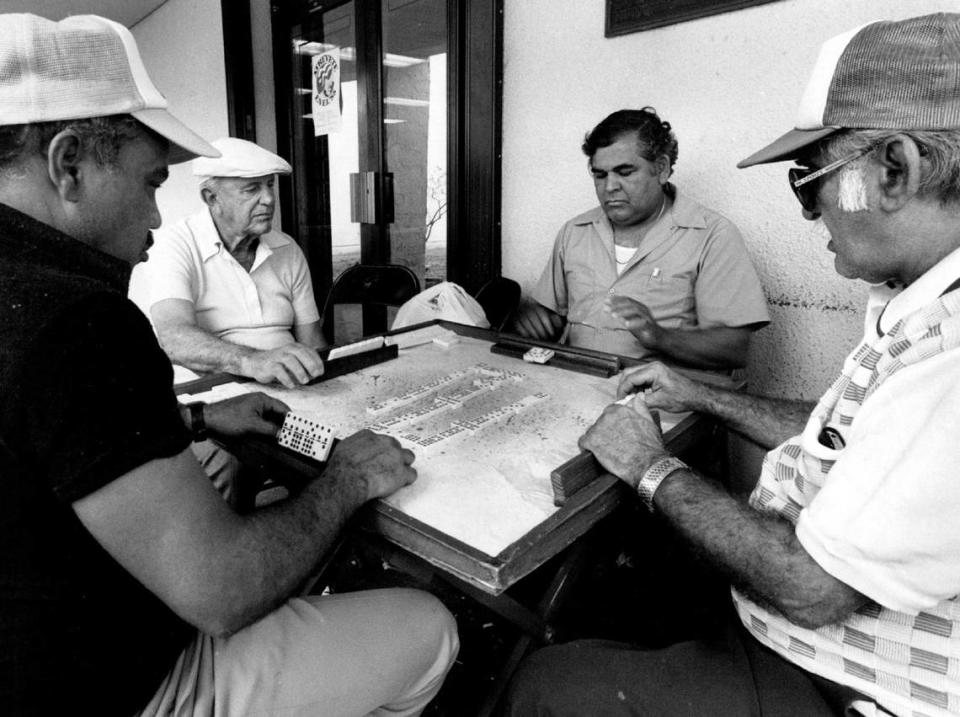 In 1988, residents of the Wynwood neighborhood pass the time playing dominoes at Eugenio Maria De Hostos Neighborhood Center on Northwest Second Avenue and 30th Street. Reggie Grant/Miami Herald File