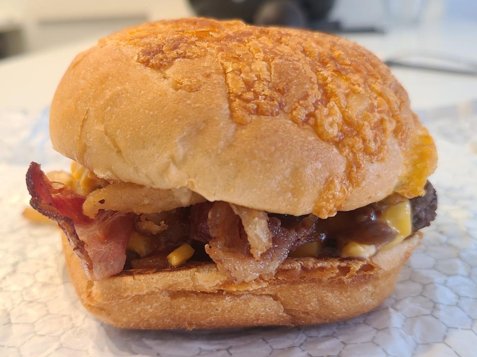 Wendy's big bacon cheddar cheeseburger on a white wrapper