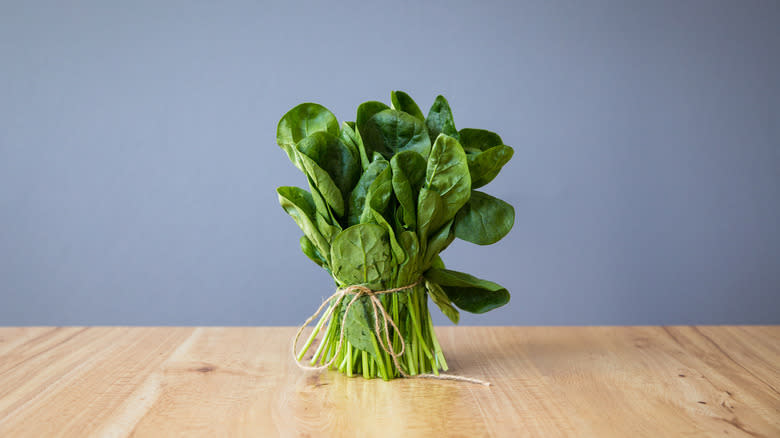 bunch of spinach on table