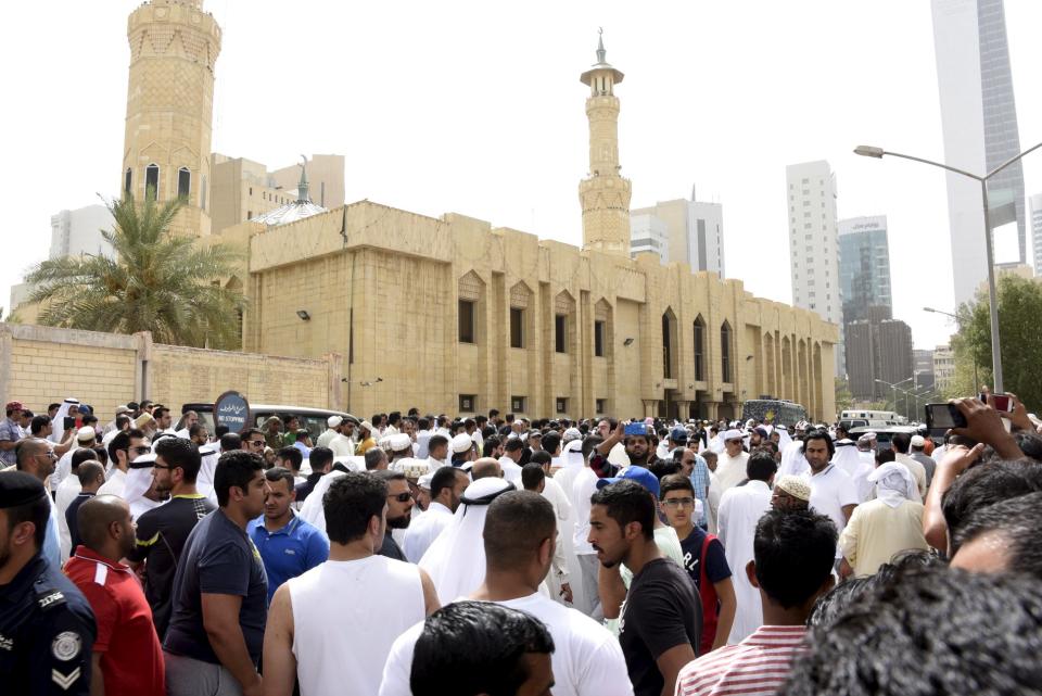 Crowds surround the Imam Sadiq Mosque after a bomb explosion following Friday prayers, in the Al Sawaber area of Kuwait City