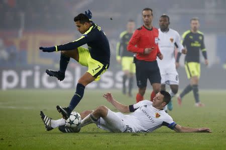 Football Soccer - FC Basel v Arsenal - UEFA Champions League Group Stage - Group A - St.Jakob-Park, Basel, Switzerland - 6/12/16 Arsenal's Alexis Sanchez in action with FC Basel's Marek Suchy Reuters / Arnd Wiegmann Livepic EDITORIAL USE ONLY.