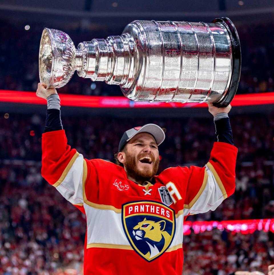 Sunrise, Florida, June 24, 2024 - Florida Panthers left wing Matthew Tkachuk (19) Raises the Stanley Cup after the Panthers defeated the Edmonton Oilers in game 7 of the Stanley Cup Final