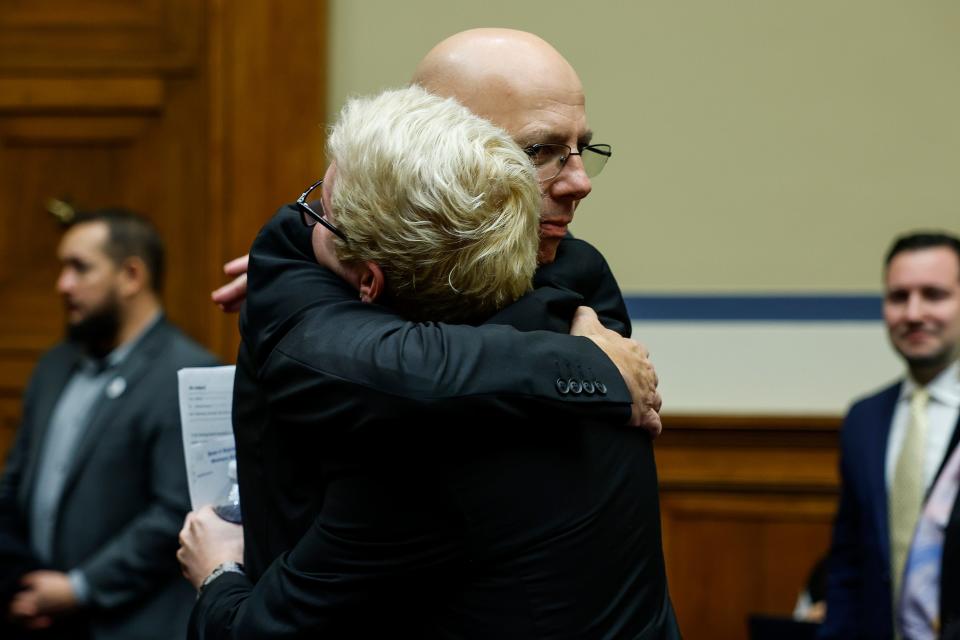 Matthew Haynes, the owner of Club Q hugs Michael Anderson, a survivor of the Club Q shooting in Colorado Springs after speaking at the House Oversight Committee hearing titled "The Rise of Anti-LGBTQI+ Extremism and Violence in the United States" at the Rayburn House Office Building on December 14, 2022 in Washington, DC.