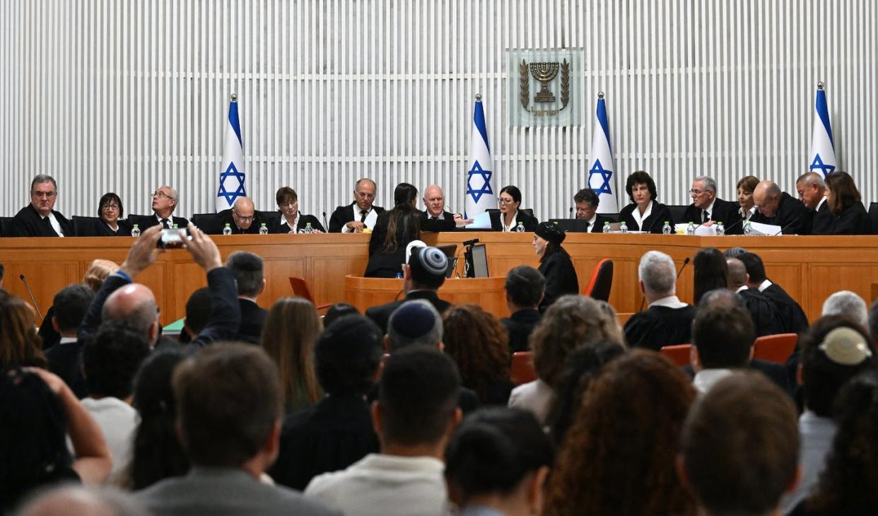 The Israeli Supreme Court assembled in September 2023 to hear arguments to strike down a controversial judicial overhaul limiting the power of the court to review and overturn government decisions. <a href="https://www.gettyimages.com/detail/news-photo/president-of-the-israeli-supreme-court-esther-hayut-and-all-news-photo/1659537878?adppopup=true" rel="nofollow noopener" target="_blank" data-ylk="slk:Debbie Hill/Pool/AFP viaGetty Images;elm:context_link;itc:0;sec:content-canvas" class="link ">Debbie Hill/Pool/AFP viaGetty Images</a>