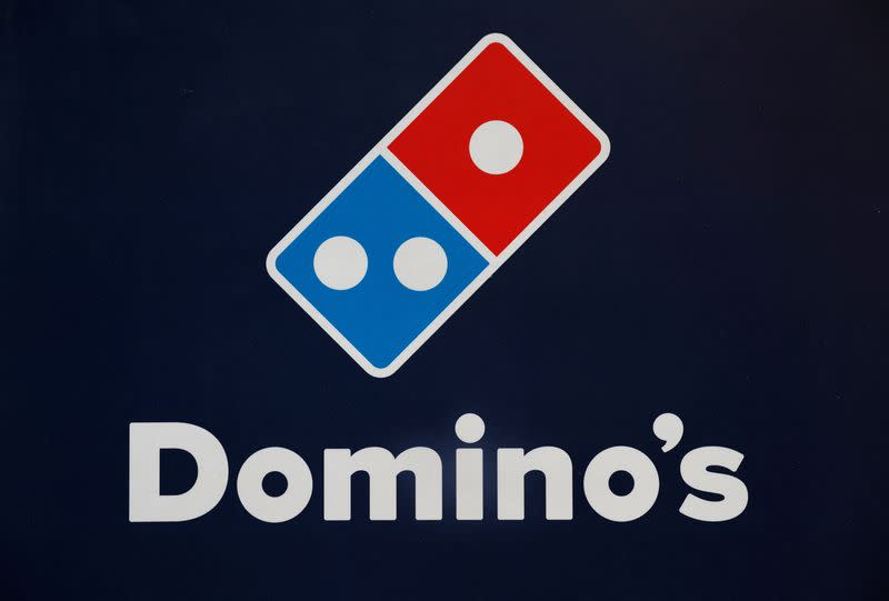 A Domino's pizza logo is pictured inside a restaurant in Noida