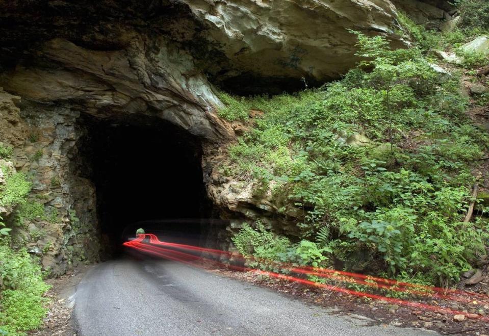 Built in the early 1900s so logs could be hauled out of the gorge by railroad, the 900-foot Nada Tunnel now allows one-lane traffic. A very long exposure in 2006 captured only the taillights of the vehicle making its way into the gorge.