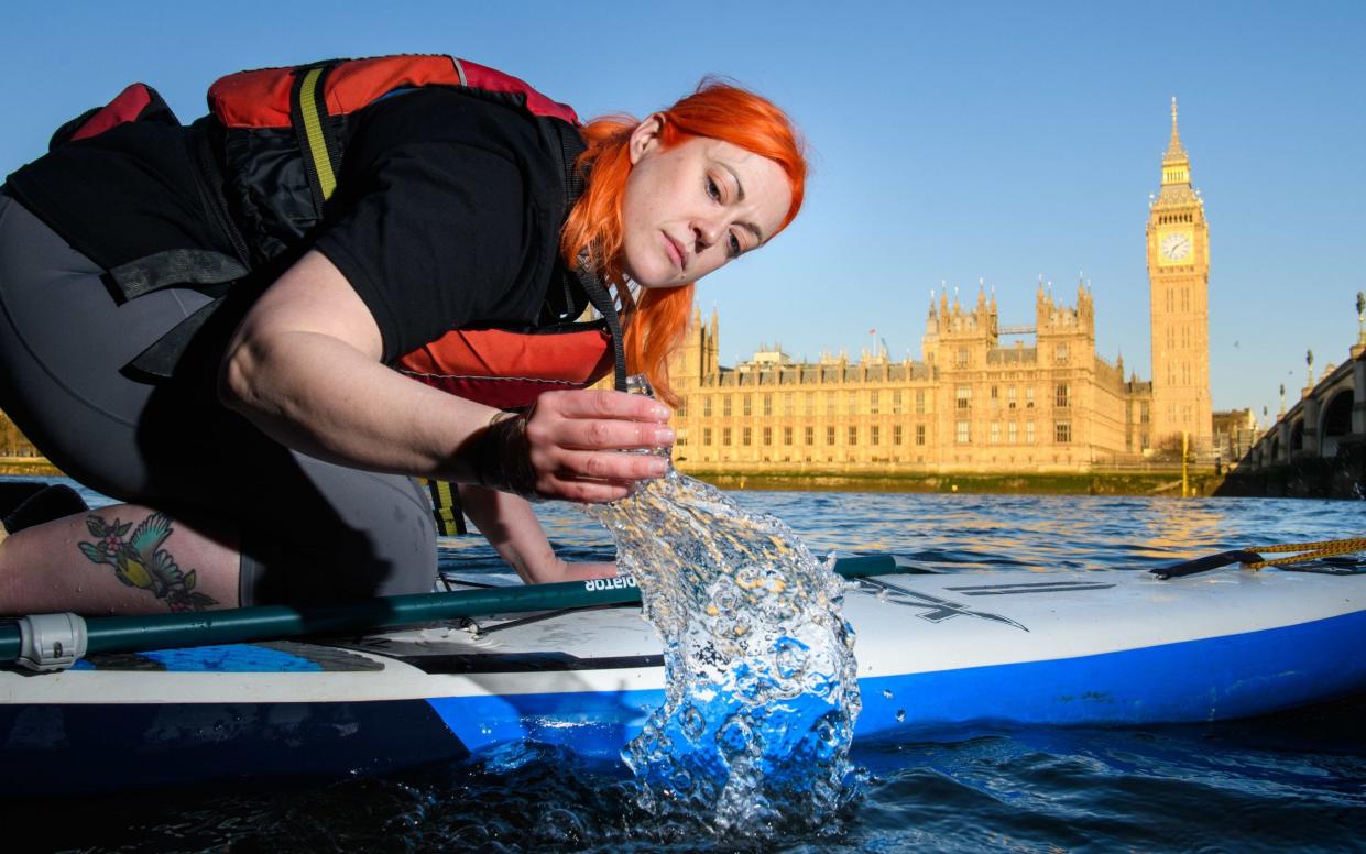 Woman tests water - Matt Crossick/PA