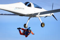 Swiss adventurer Raphael Domjan jumps from the SolarStratos solar powered aircraft prototype with Spanish test pilot Miguel A. Iturmendi aboard during a test flight and attempt to break two world records at the airbase in Payerne, Switzerland, Tuesday, Aug. 25, 2020. Two world record were made during today's test flight, the first jump in history from an electric aircraft exclusively charged with solar energy and the first solar free fall. The main objective of the SolarStratos Mission project is to be the first solar flight to achieve stratospheric flight. (Laurent Gillieron/Keystone via AP)