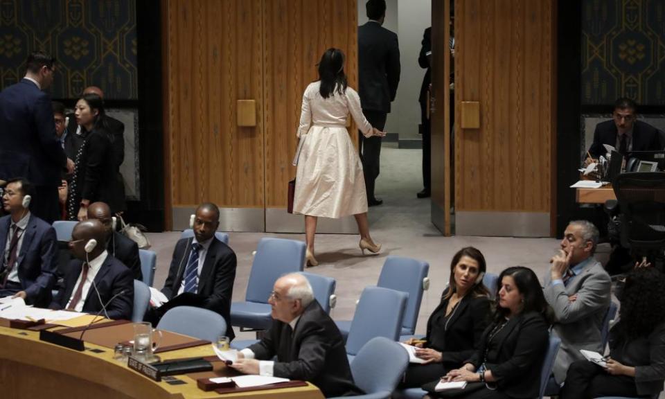 Haley walks out of the chamber as the permanent observer of Palestine to the UN, Riyad Mansour, begins to speak at a UN security council meeting on 15 May 2018.