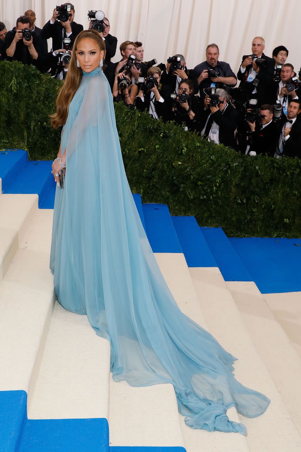 <p>She looked ethereal in a caped blue dress by Valentino at the 2017 Met Gala. </p>