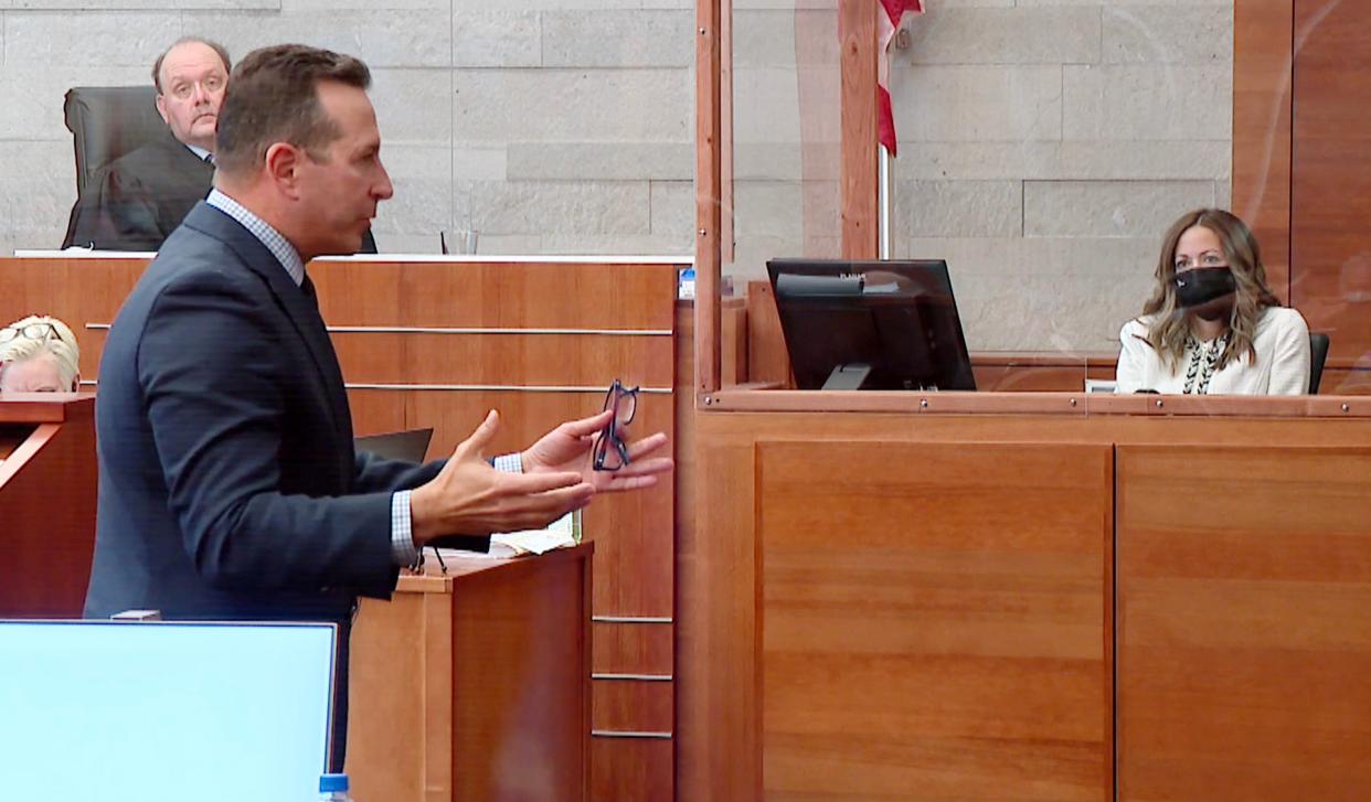 As Franklin County Common Pleas Judge Michael Holbrook (back left) looks on, defense attorney questions Dr. Gina Moody, a former colleague of former doctor William Husel at the Mount Carmel West hospital ICU, during testimony Tuesday in Husel's trial on 14 counts of murder for allegedly using excessive dosages of painkillers to hasten the deaths of patients in his care.