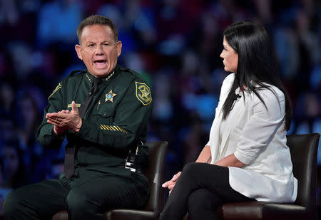 Broward Sheriff Scott Israel (L) makes a point to NRA Spokesperson Dana Loesch during a CNN town hall meeting, at the BB&T Center, in Sunrise, Florida, U.S. February 21, 2018. REUTERS/Michael Laughlin/Pool