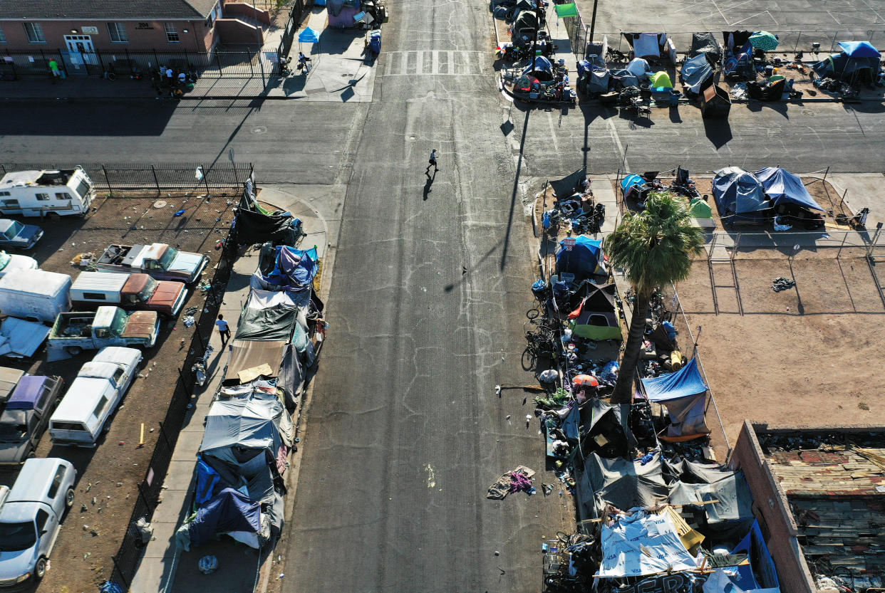 In an aerial view, people walk through Phoenix's largest homeless encampment during the city's worst heat wave on record on July 26, 2023. / Credit: Mario Tama/Getty Images