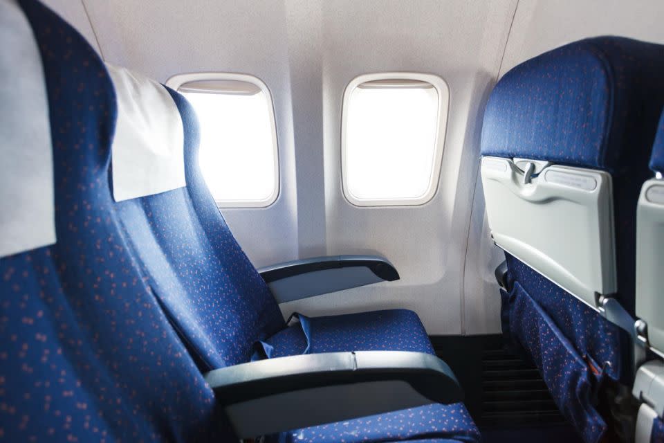 Experts suggest to only recline your seat halfway. Photo: Getty