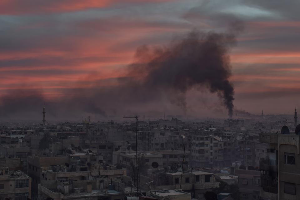 <p>Smoke rises after Assad Regime carried out an airstrike at Duma town of Eastern Ghouta in Damascus, Syria on April 7, 2018. (Photo: Mouneb Taim/Anadolu Agency/Getty Images) </p>