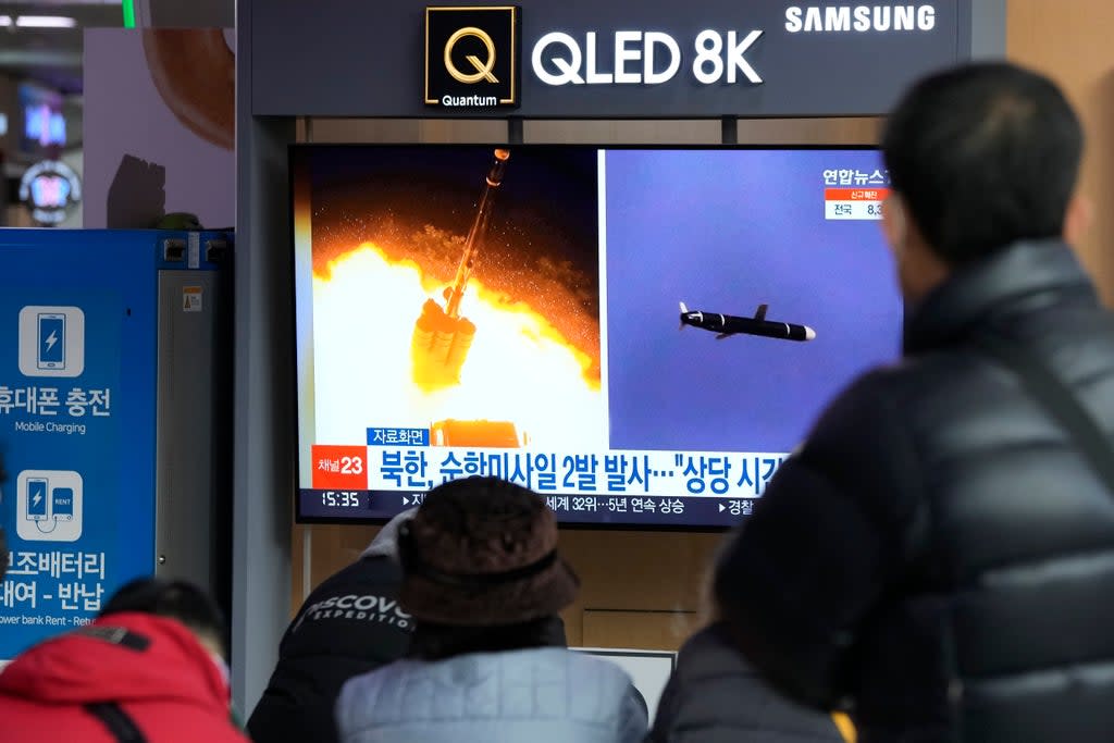 File: People watch a TV showing file images of North Korea’s missile launch (AP)