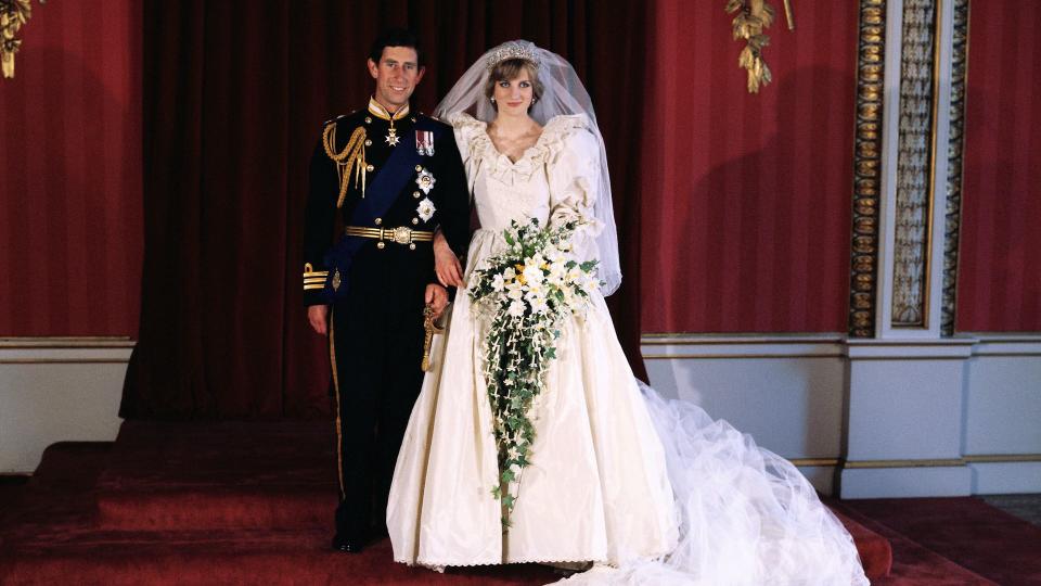 King Charles in military uniform stood with Princess Diana in a wedding dress