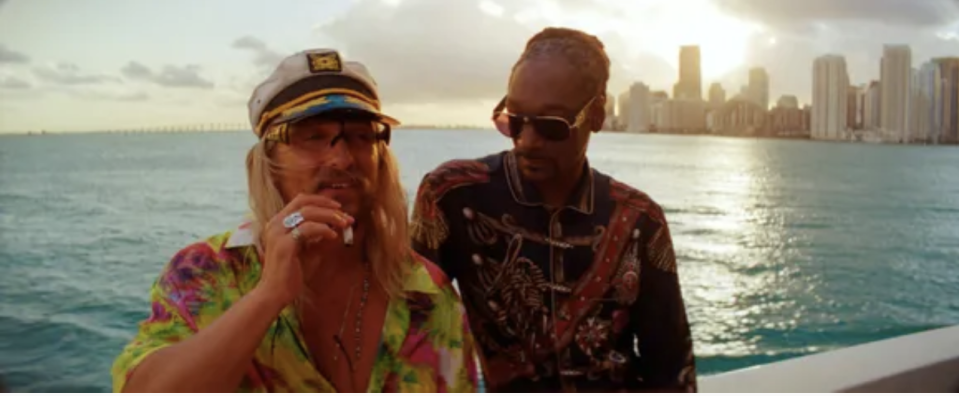 Moondog (Matthew McConaughey, left) and Lingerie (Snoop Dogg) enjoy a smoke on the water in 