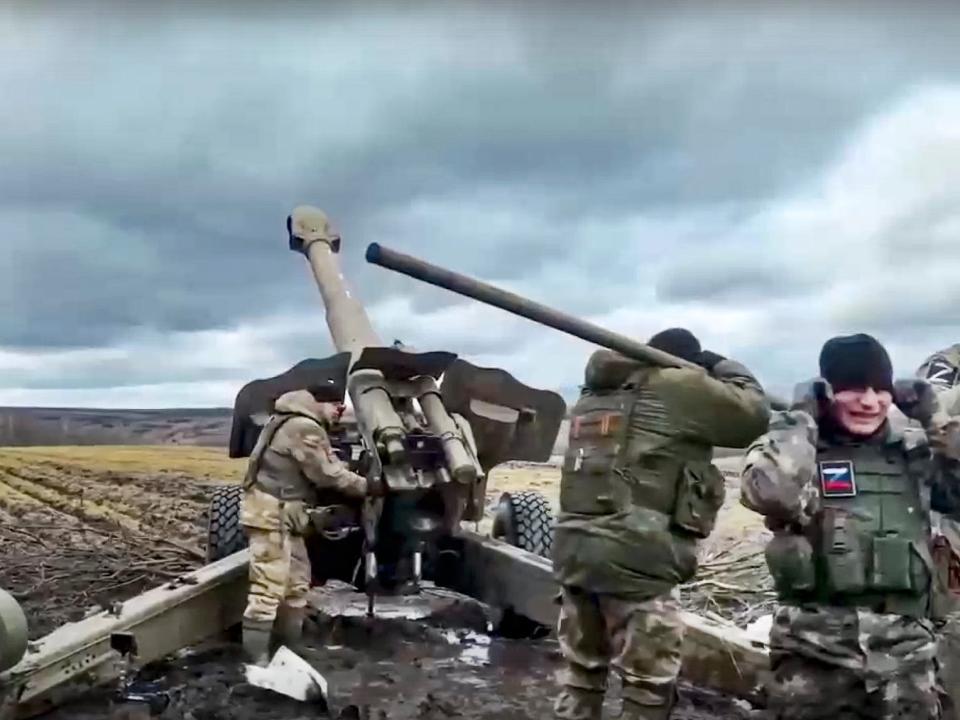 In this handout photo taken from video and released by Russian Defense Ministry Press Service on Wednesday, March 22, 2023, a Russian army's howitzer fires at Ukrainian troops at an undisclosed location.