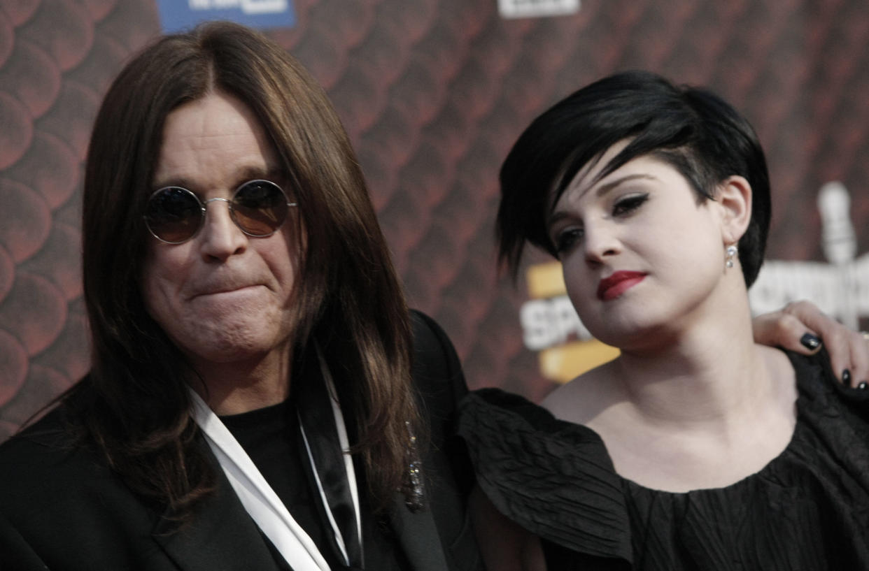 Ozzy Osbourne, left, and daughter Kelly Osbourne arrive at the Scream Awards on Saturday Oct. 18, 2008 in Los Angeles. (AP Photo/Dan Steinberg)