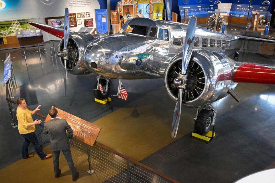 A Lockheed Electra 10-E aircraft named Muriel, the last one in the world, is the centerpiece of the new Amelia Earhart Hangar Museum, which will open on Friday, April 14, 2023, in Atchison, Kansas. Makinzie Burghart, director of operations, escorts Douglass Adair of Exchange Bank & Trust of Atchison, a founding donor, on a tour of the hangar museum Tuesday, April 11, 2023. The aircraft is the same make and model as famed aviator Amelia Earhart flew on her last flight as she tried to circumnavigate the globe in 1937. The restorer of the aircraft, named the plane Muriel, after Earhart’s sister.