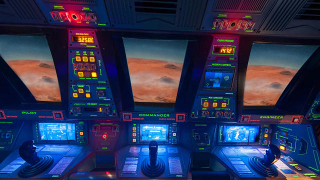 A view of the lit up control console inside Mission: Space.
