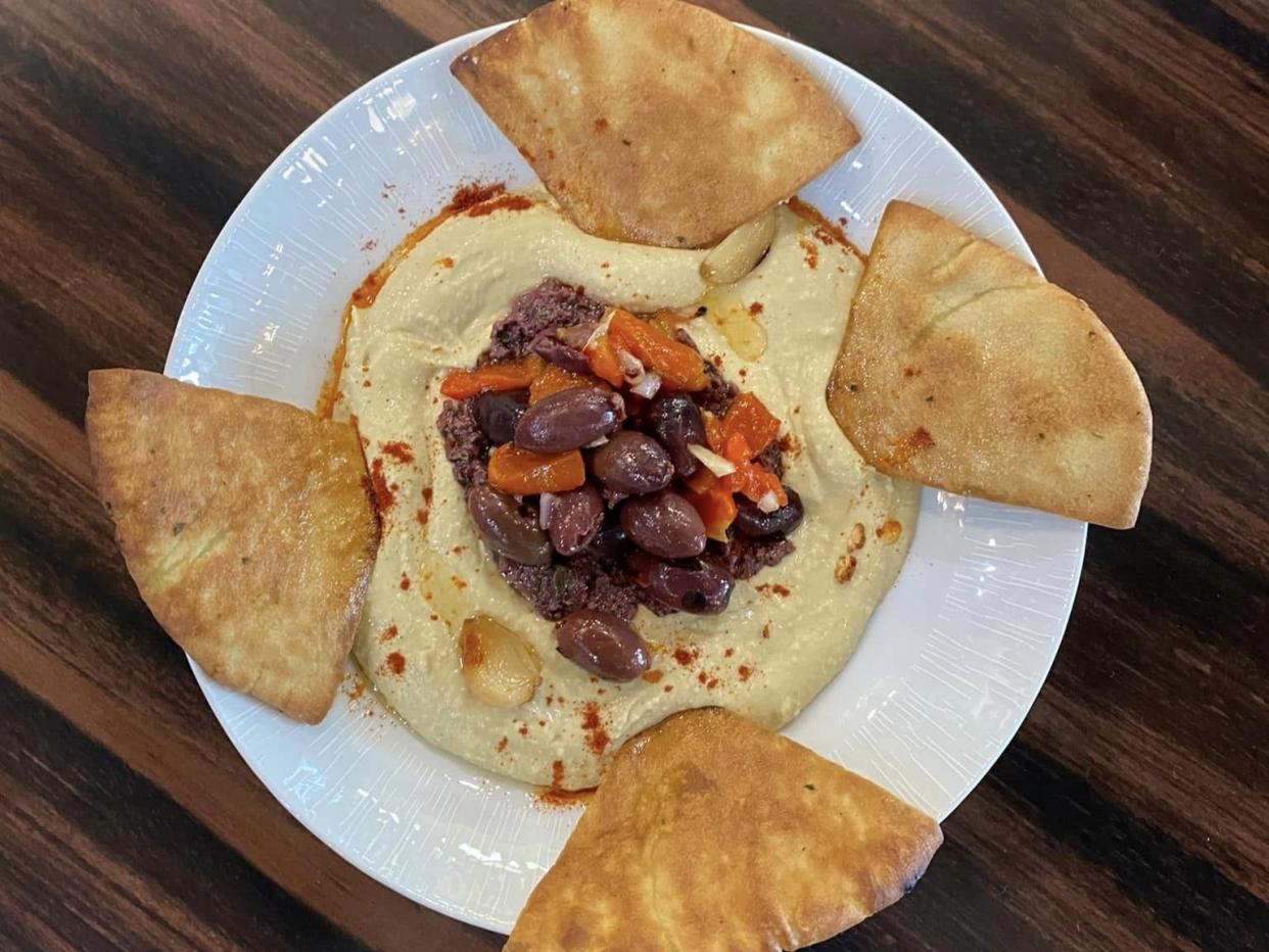 The menu at Blu Ocean Grille in Port St. Lucie features a house-made Middle Eastern hummus with olive tapenade, roasted garlic, grilled pita, extra virgin olive oil and smoked paprika.