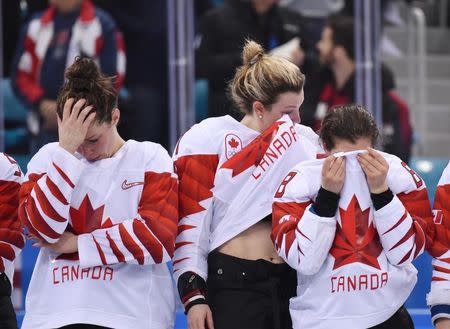 Feb 22, 2018; Gangneung, South Korea; Canada players from left Rebecca Johnston Laura Stacey and Laura Fortino react after losing to the United States in the women's ice hockey gold medal match during the Pyeongchang 2018 Olympic Winter Games at Gangneung Hockey Centre. Mandatory Credit: Andrew Nelles-USA TODAY Sports