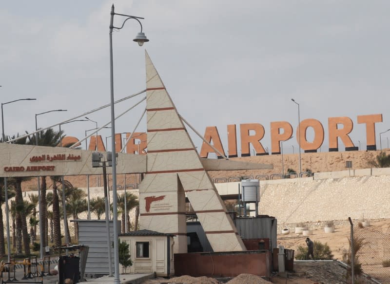 An Egyptian security member walks near the security gate of the Cairo's Internatonal Airport, following ramps up its efforts to slow the spread the coronavirus disease (COVID-19) in Cairo