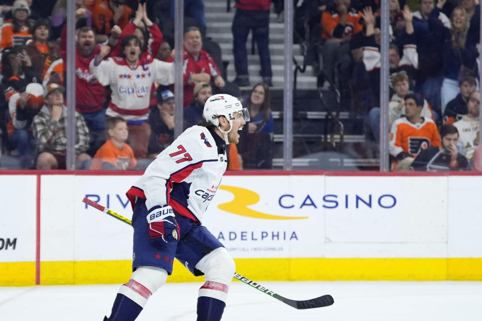 Washington Capitals' T.J. Oshie, left, celebrates after scoring a goal during the third second period of an NHL hockey game against the Philadelphia Flyers, Tuesday, April 16, 2024, in Philadelphia. (AP Photo/Matt Slocum)