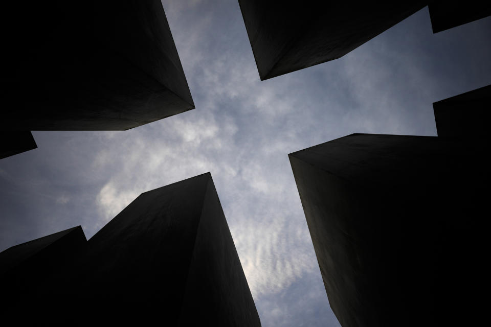 Clouds cover the sky over the Holocaust memorial at the eve of the the 84th anniversary of the Kristallnacht in Berlin, Germany, Tuesday, Nov. 8, 2022. Holocaust survivors from around the world are warning about the reemergence of antisemitism as they commemorated Wednesday, Nov. 9, 2022, the 84th anniversary of the Kristallnacht or the "Night of Broken Glass", when Nazis terrorized Jews throughout Germany and Austria. (AP Photo/Markus Schreiber)